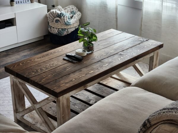 Farmstyle coffee table with beige couch and plant on top
