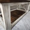 Farmstyle coffee table showing lower wooden shelf