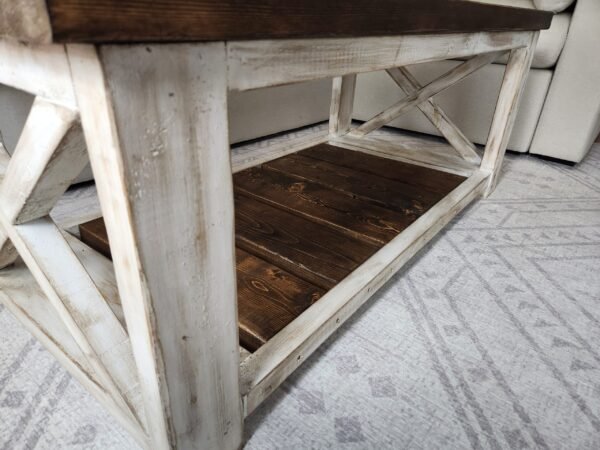 Farmstyle coffee table showing lower wooden shelf